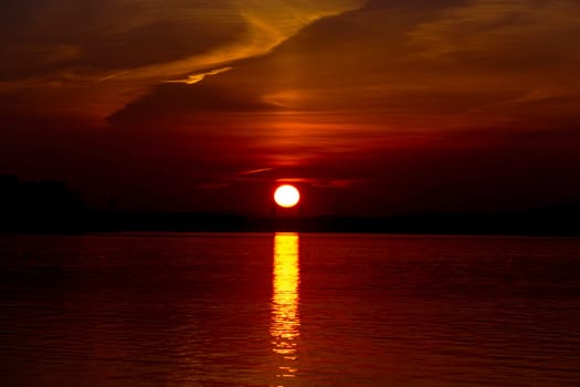 Golden sunset on the beach at neva river in saint-petersburg, russia. Tranquil scene. Nature background. Landscape. High quality photo