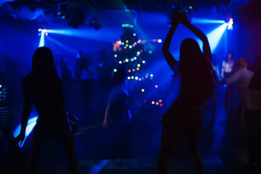 silhouette of a go-go dancer girl on stage in a nightclub