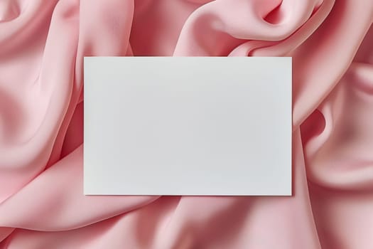 Minimalist aesthetic mockup from white blank A5 letterhead on pink silk fabric.