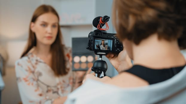 Two influencer partner shoot live streaming vlog video review makeup prim social media or blog. Happy young girl with cosmetics studio lighting for marketing recording session broadcasting online.