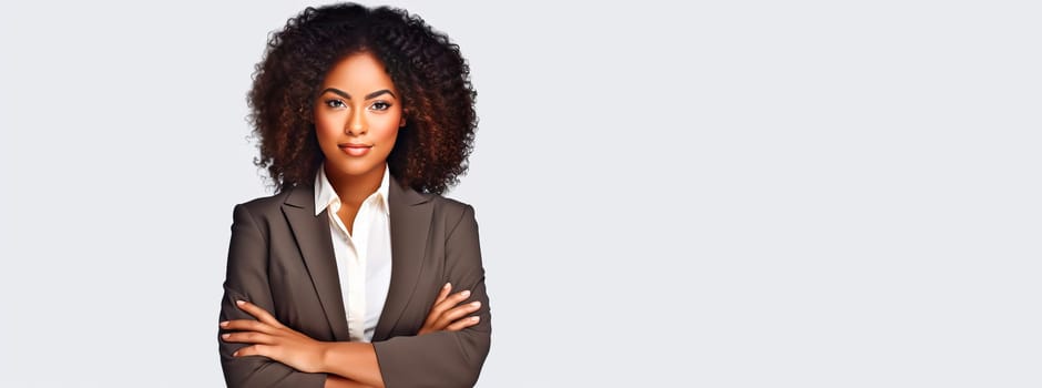 Portrait of a stylish, elegant, authoritative young woman, business woman in a white office. African American woman with dark skin and curly hair is wearing a shirt and jacket, suit, dress code.