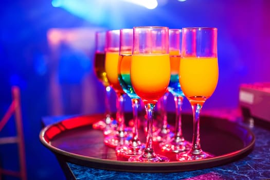 cocktails and alcoholic beverages in glasses at a celebration in the night club