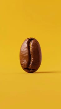 Minimalist shot of a coffee bean isolated on yellow background.