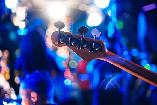 guitar neck at a live concert close-up on a blurry background