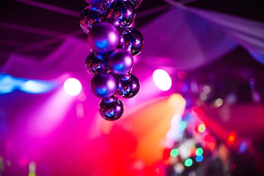 beautiful bright background with multicolored Christmas balls on the front background with reflection