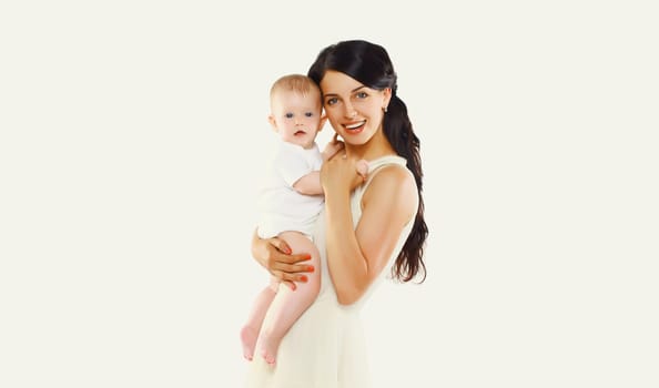 Happy cheerful smiling young mother holding baby on white studio background