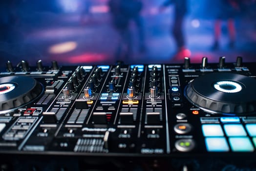 professional panel of the DJ console for mixing music in a nightclub at a party