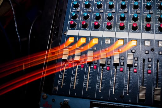 professional music equipment to create and mix music with volume levels and the volume of the music closeup