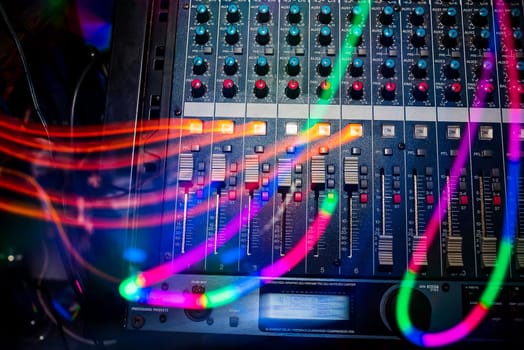 professional music equipment to create and mix music with volume levels and the volume of the music closeup