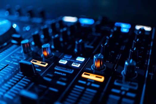 buttons mixer and control music on professional equipment DJ blue