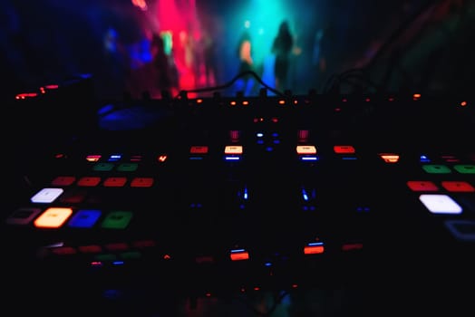 mixer control DJ in a nightclub to control the music at the party