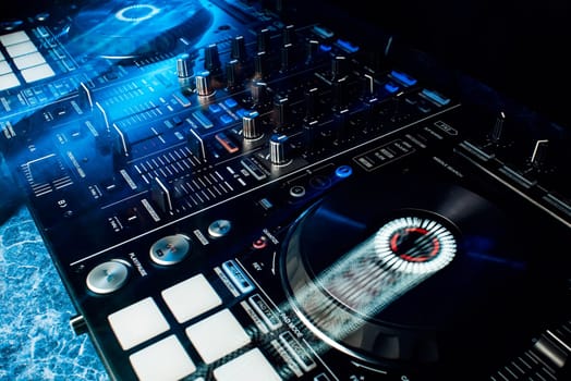 modern professional equipment for DJ to mix music with light effects