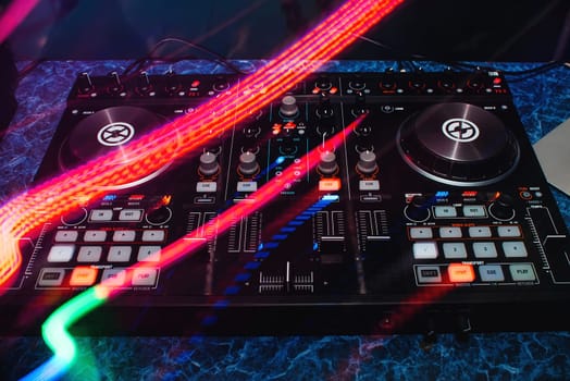 modern professional DJ Board with colorful effects for games and music mixing on the table