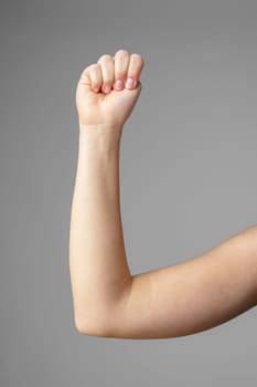 Woman Holding Arm Up in the Air with Gesture close up