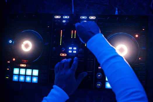 mixer and DJ booth in a night club with the owner for professional music managers top view