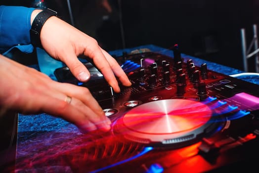 DJ mix music hands on professional music equipment for CDs with buttons and controllers with light effects