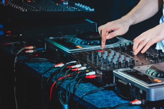 music equipment to play music for the DJ and man hands