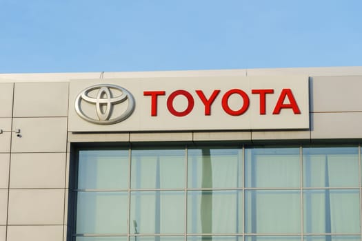 Tyumen, Russia-March 02, 2024: Toyota logo Sign Against Blue Sky. Selective focus