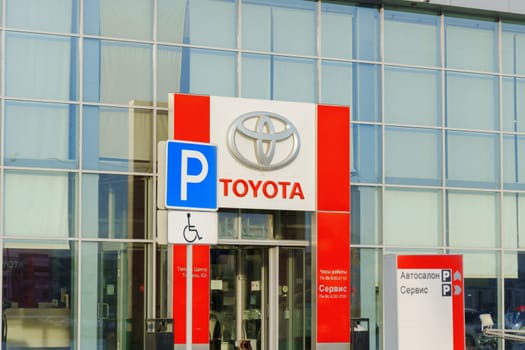 Tyumen, Russia-March 02, 2024: Toyota sign standing prominently against a clear blue sky, showcasing the iconic brand logo