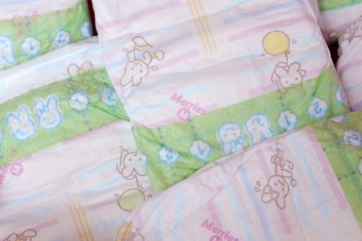 Tyumen, Russia-March 02, 2024: Detailed close-up of a bag of Merries baby diapers, showcasing the brand logo and packaging design.