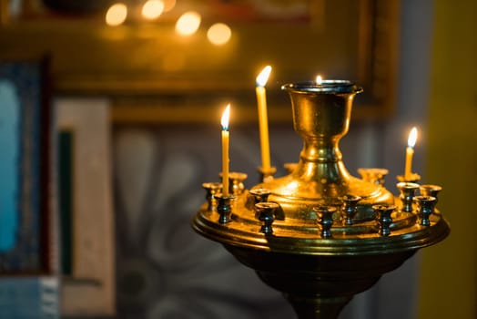 burning candles at the altar in Christian Orthodox church