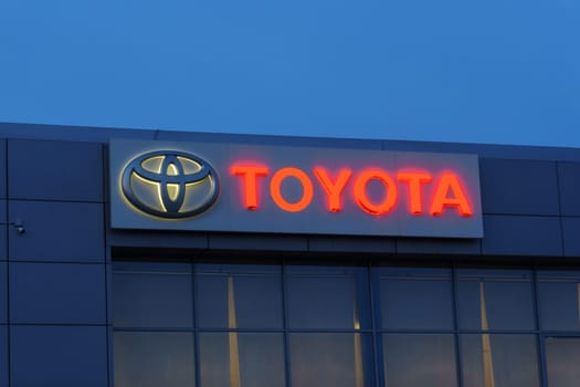 Tyumen, Russia-March 18, 2024: Toyota sign standing prominently against a clear blue sky, showcasing the iconic brand logo