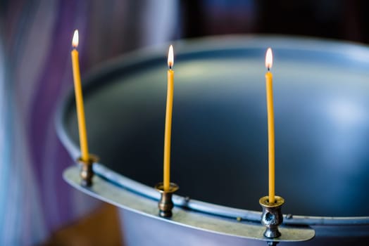 burning candles at the altar in Christian Orthodox church