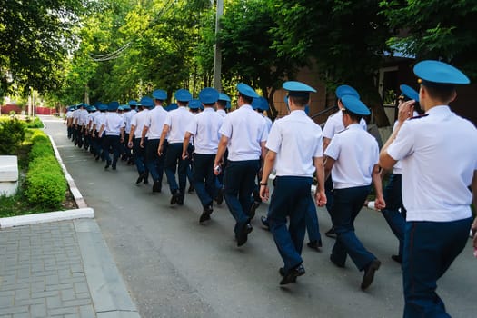 Russian police squad is walking down the street