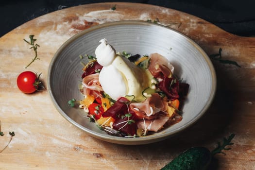 A wooden cutting board holds a beautifully presented bowl of delicious and freshly made food, ready to be enjoyed.