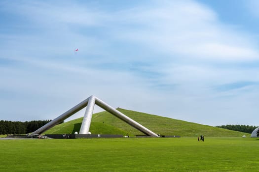 SAPPORO, JAPAN - MAY 05, 2024 : Huge triangular metal pyramid in Moerenuma Park in Summer Day where is a Famous Landmark of Sapporo, Japan..