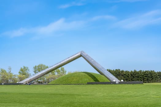 SAPPORO, JAPAN - MAY 05, 2024 : Huge triangular metal pyramid in Moerenuma Park in Summer Day where is a Famous Landmark of Sapporo, Japan..