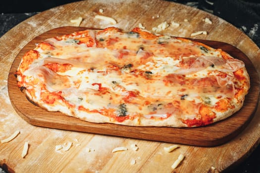 A freshly baked pizza sitting on a rustic wooden cutting board, with steam rising from the golden crust and cheese.