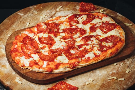 A mouthwatering pepperoni pizza sits on a rustic wooden cutting board, fresh out of the oven and ready to be devoured.