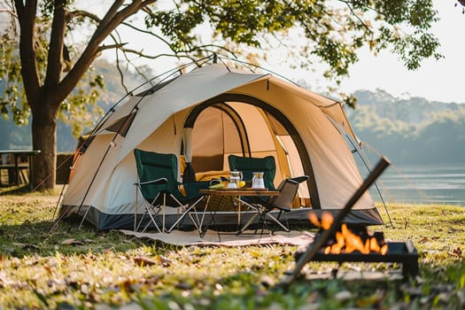 Camping outdoors with lots of sunlight. tent, chairs, a tent BBQ rack, and more.