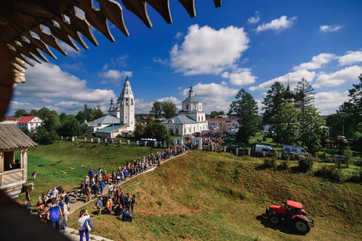 LUH, RUSSIA - AUGUST 27, 2016: Temple ensemble of the village of Luh with tourists on the holiday of Onion day, Russia