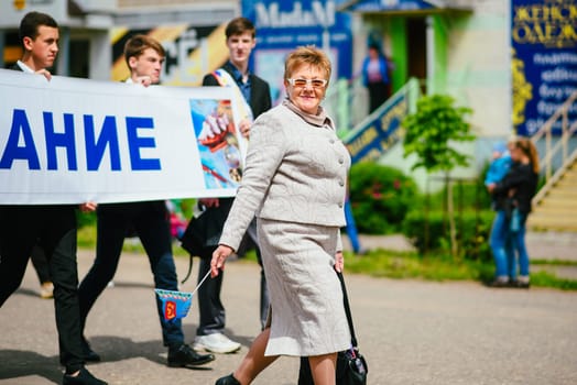 VICHUGA, RUSSIA - JUNE 24, 2017: Festive procession of people on the street on the Day of Vichuga, Russia