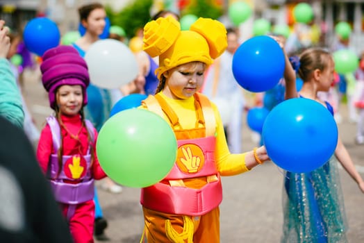 VICHUGA, RUSSIA - JUNE 24, 2017: Festive procession of people on the street on the Day of Vichuga, Russia