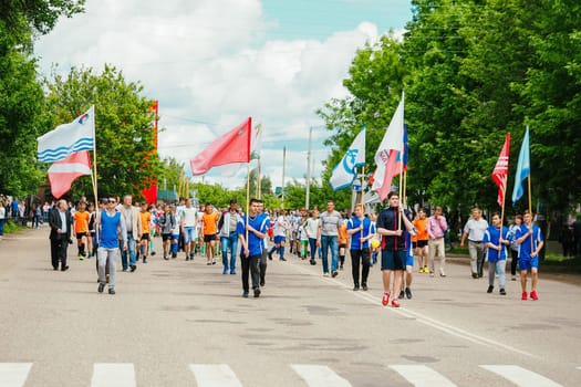 VICHUGA, RUSSIA - JUNE 24, 2017: Festive procession of people on the street on the Day of Vichuga, Russia