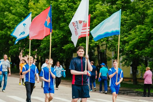 VICHUGA, RUSSIA - JUNE 24, 2017: Festive procession of people on the street on the Day of Vichuga, Russia