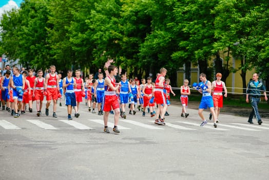 VICHUGA, RUSSIA - JUNE 24, 2017: Festive procession of people on the street on the Day of Vichuga, Russia