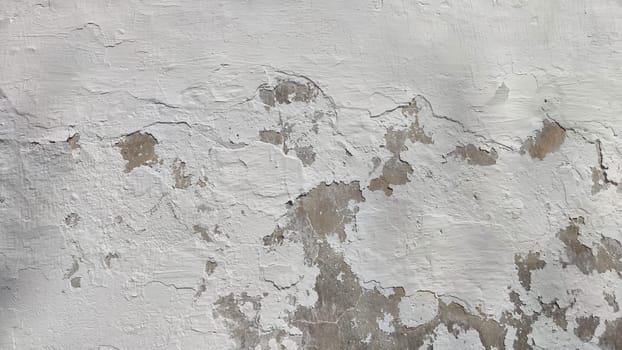 Old plaster. Background, texture. Close-up of a crumbling plaster wall revealing layers and texture