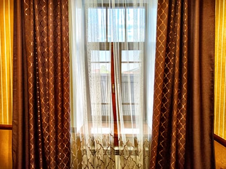 Morning Light Filtering Through Lace Curtains in a Cozy Room. Chiffon curtain on the window in the room