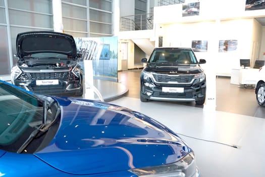 Kazan, Russia - November 25, 2022: Cars in showroom of dealership Kia in Kazan in Russia. Partial focus