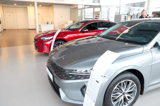 Kazan, Russia - November 25, 2022: Cars in showroom of dealership Kia in Kazan in Russia. Partial focus