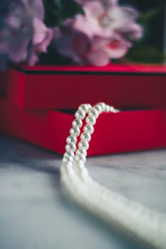 wonderful pearls in a red gift box, luxe present - jewellery and luxury gift for her styled concept, elegant visuals