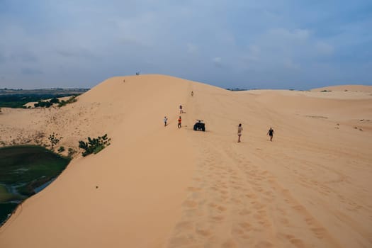 White Sand Dunes Muine in Vietnam with tourists in the summer