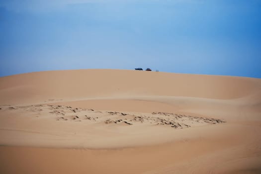 White Sand Dunes Muine in Vietnam with tourists in the summer