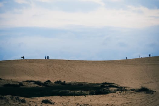 White Sand Dunes Muine in Vietnam with tourists in the summer
