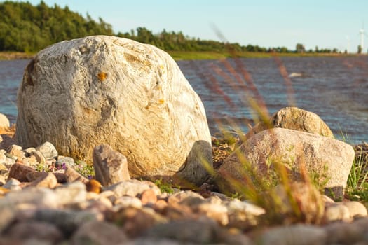 large stone lies on the seashore, wild nature