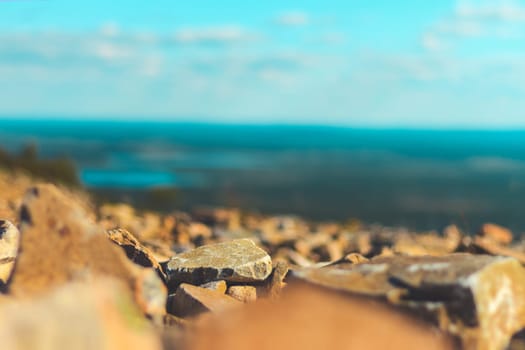 view from the mountain, stones in the foreground and perspective, disasters
